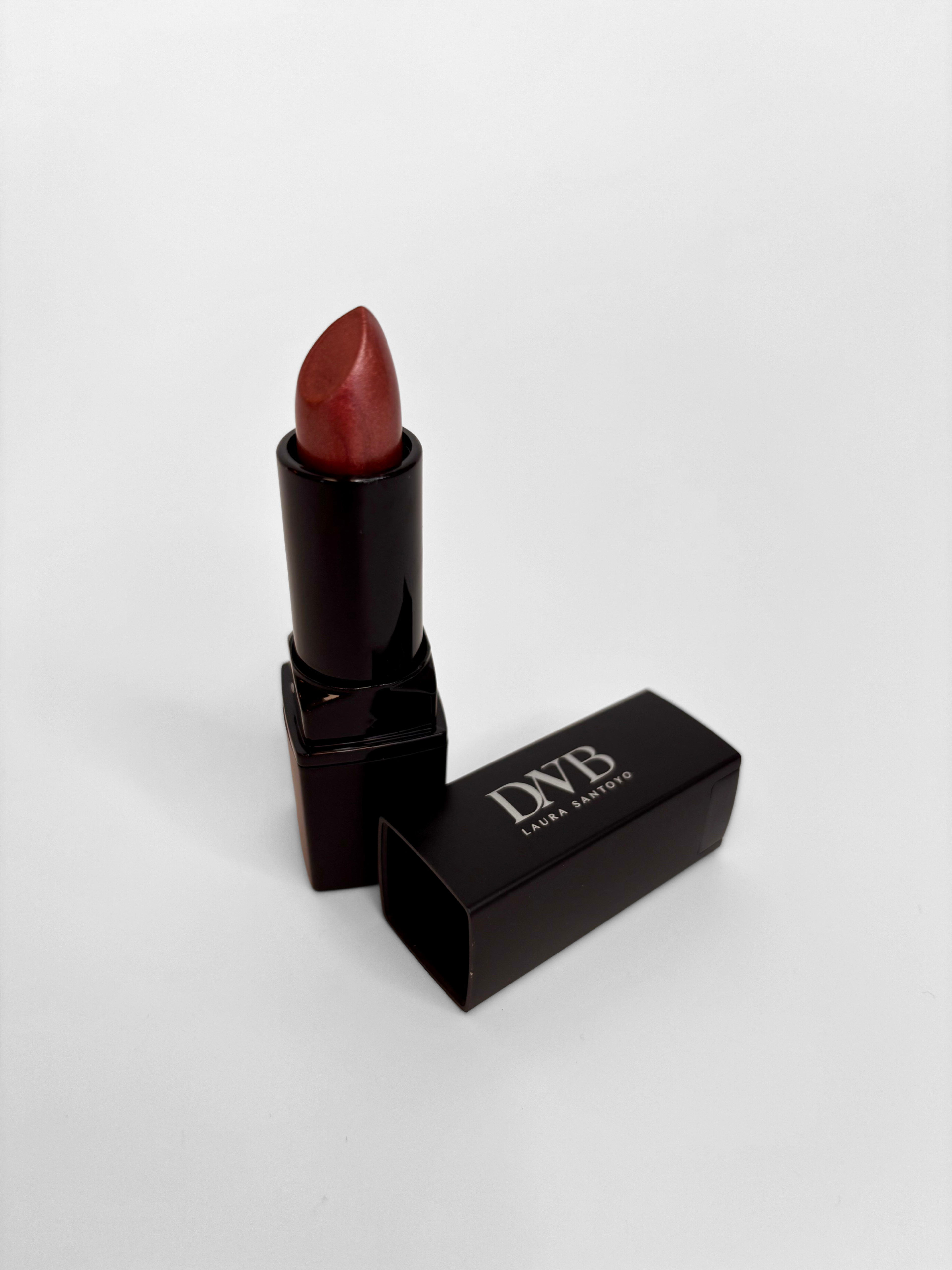 Lipstick with black case on a white background