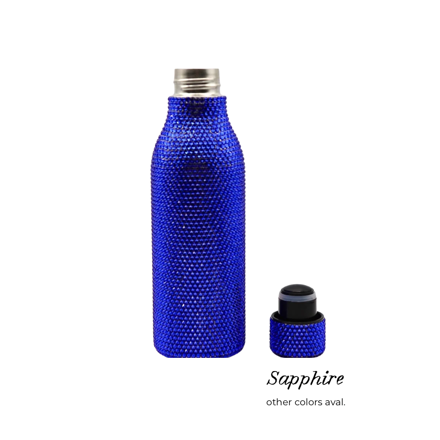 A cobalt blue water bottle covered in small rhinestones, shown with its matching cap beside it on a white background. The text 'Sapphire' and 'other colors aval.