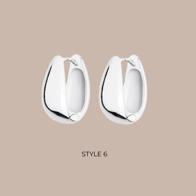 A pair of polished silver huggie hoop earrings with a small central bead detail, shown against a solid beige background with the text 'STYLE 6' below.