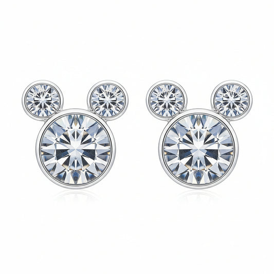 A pair of mouse-shaped stud earrings with a clear stone, displayed on a black and gold card with the brand 'DateNite' written on it, against a yellow glittery background.